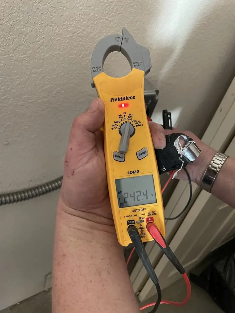 Voltage testing with clamp meter during Ceiling Fan Installation in Fairview Park